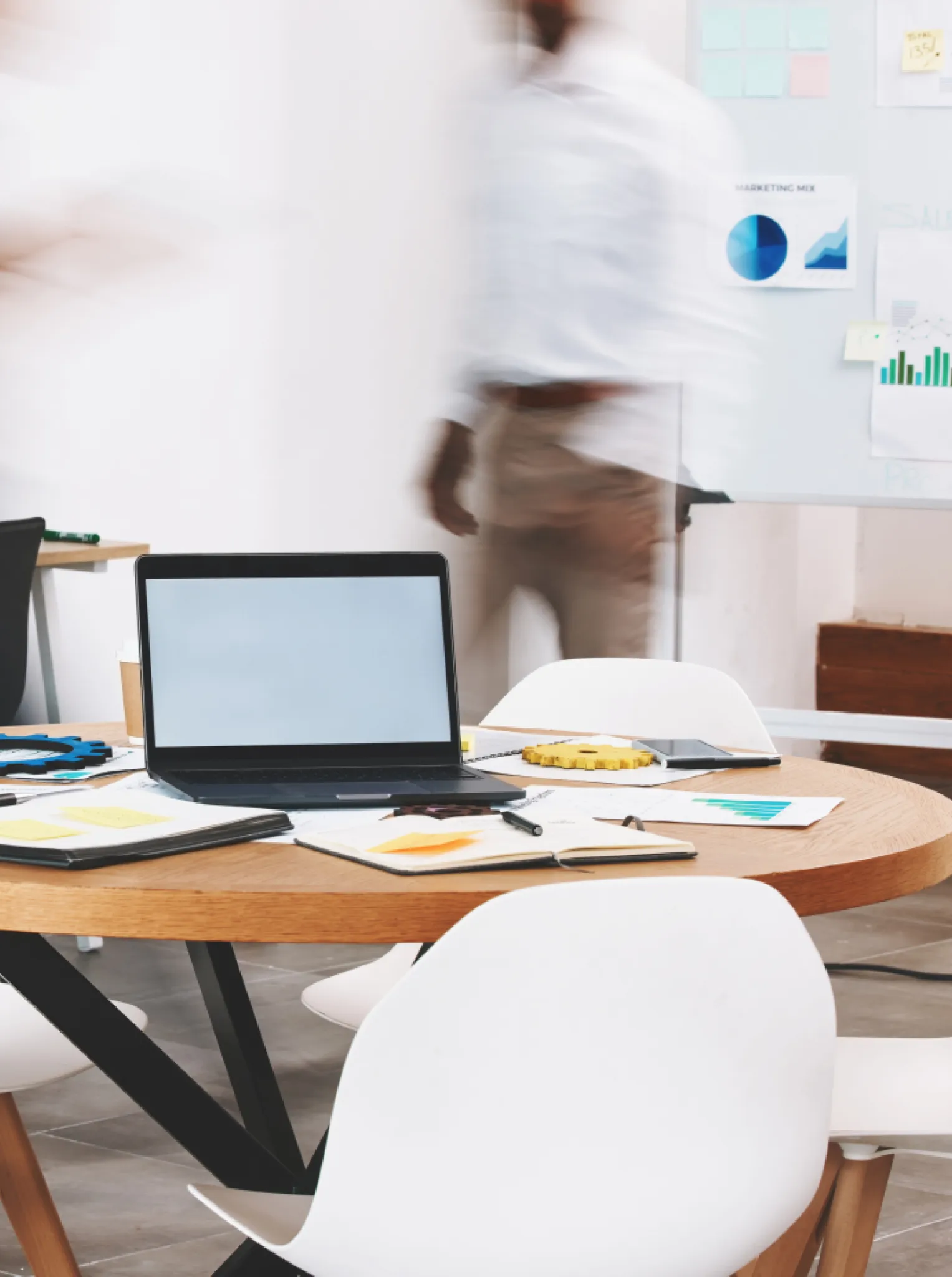 Modern marketing workspace with digital tools and strategy charts.